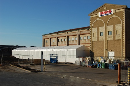 Temporary marquee alongside existing Tesco store Temporary marquee alongside existing Tesco store