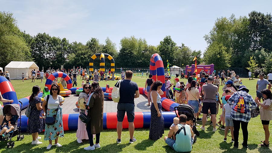 Photo of attractions at a school summer fair.