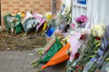 Floral tributes outside the property