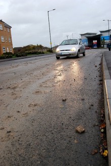 Mud on the road into the Willow Brook Centre, Bradley Stoke