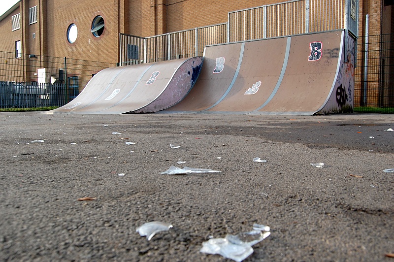 Broken glass litters the surface of Bradley Stoke Skate Park on a Saturday morning.