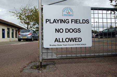 Sign at Baileys Court Activity Centre: "Playing fields - no dogs allowed".