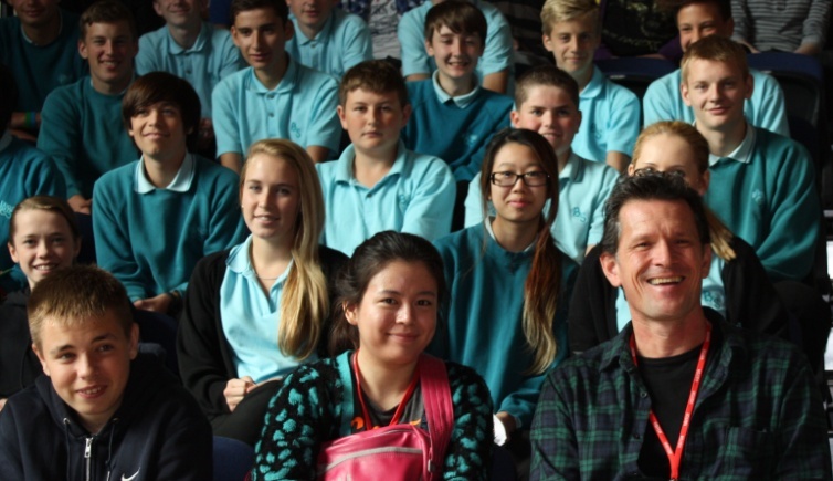 Willie Harcourt-Cooze with students of Bradley Stoke Community School.