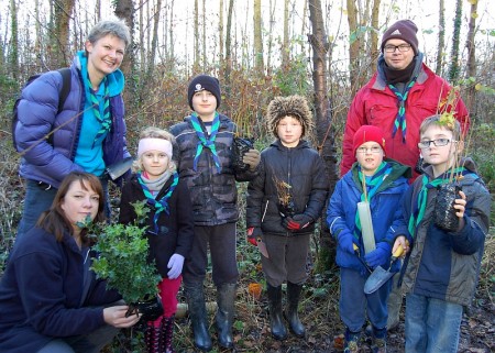 Beavers help plant a hedgerow in the Three Brooks Local Nature Reserve.