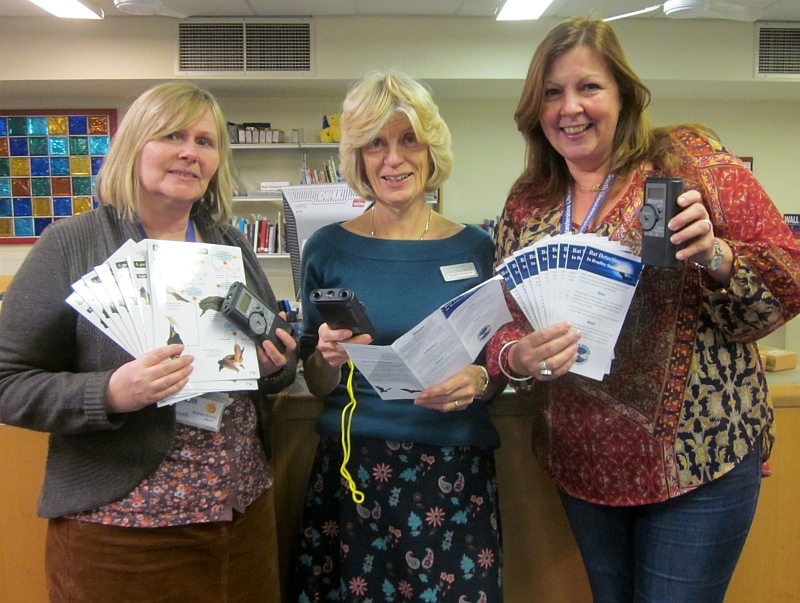 Staff at Bradley Stoke Library with bat detectors and field guides.