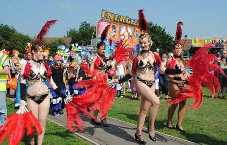 Bradley Stoke Carnival dancers and funfair on Jubilee Green.
