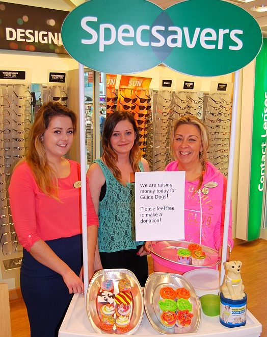 Staff at the Specsavers store in Bradley Stoke sell cupcakes in support of Guide Dogs Week. L-R: Beth, Hollie and Marcela.