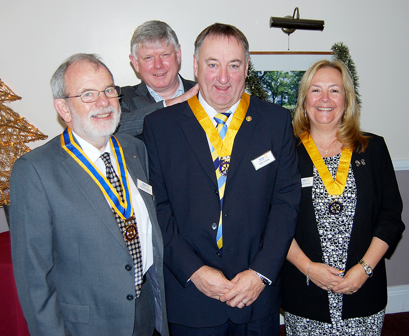 Bradley Stoke Rotary Club president Phil King presents new regalia to (front, l-r): Roger Worth, Bob Warne and Karen Holley.