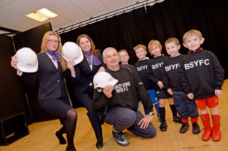 Sales Executives Hannah and Evelyn with team coach Martin Lee and members of Bradley Stoke Youth FC wearing their sweatshirts funded by Taylor Wimpey.