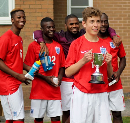 Adam Wilson celebrates with the England U23 football team.