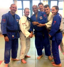 Bradley Stoke Judo Club's Eleanor Young (2nd from left) is presented with her black belt.