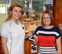 Katy Robinson (right) receives her membership card from Anca Leru, manager of LivingWell Health Club, Hilton Bristol Hotel.