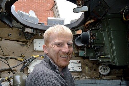 Jeff Woolmer, sitting in the commander's seat of the Scorpion tank he purchased through a online auction site.