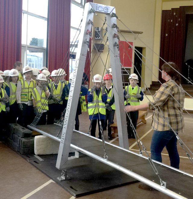 Staff from Alun Griffiths (Contractors) Ltd present the 'Bridge to Schools' project at Little Stoke Primary School.