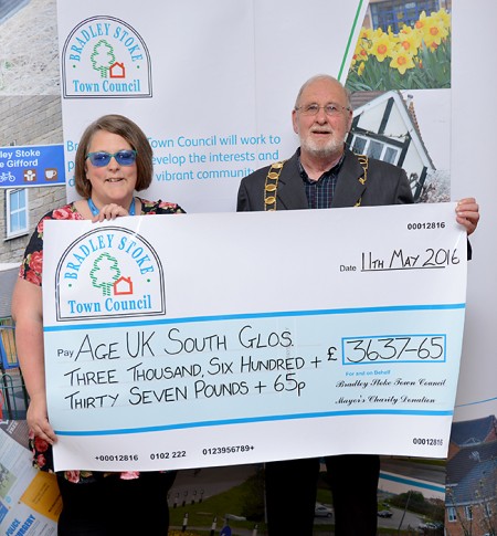 Cllr Roger Avenin presents a mayor's charity cheque to Michelle Dent of Age UK South Gloucestershire.