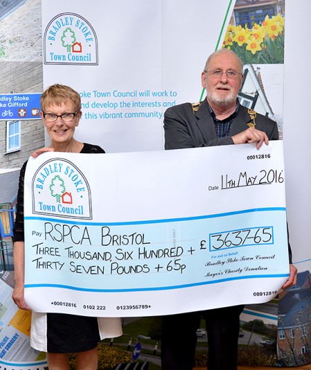 Cllr Roger Avenin presents a mayor's charity cheque to Linda Harper, a trustee of the RSPCA's Bristol & District Branch.