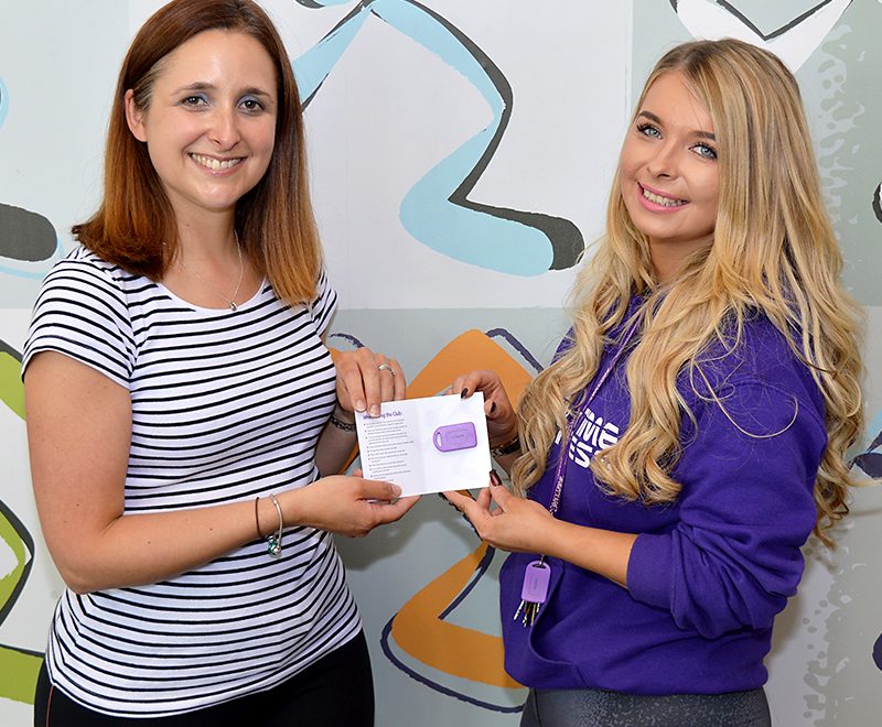 Davina Smythe (left) receives her membership card from Charlotte Maggs, club manager at Anytime Fitness Bradley Stoke.