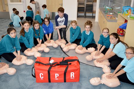 Year 7 students at Bradley Stoke Community School receive instruction in CPR from Post-16 students trained by the British Heart Foundation.