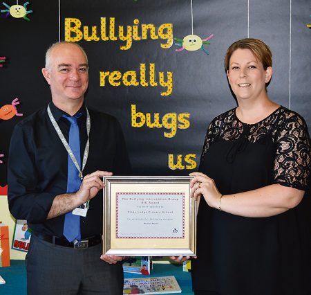 Stoke Lodge Primary School headteacher Richard Clark (left) and anti-bullying co-ordinator Claire Bruford with the school’s BIG award certificate