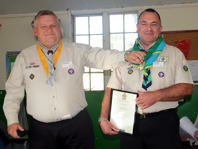 L-r: Graham Brant (Avon Scouts County Commissioner) presents the Scouting Award for Merit to Clive Mason (Group Scout Leader, 1st Bradley Stoke Scout Group).
