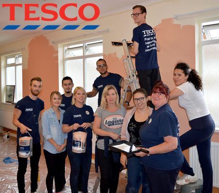 Staff from the Tesco Extra store in Bradley Stoke decorate a room at Patchway Community Centre.