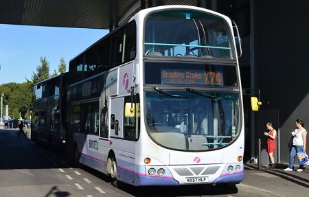 An X74 bus waits at the Willow Brook Centre, Bradley Stoke.