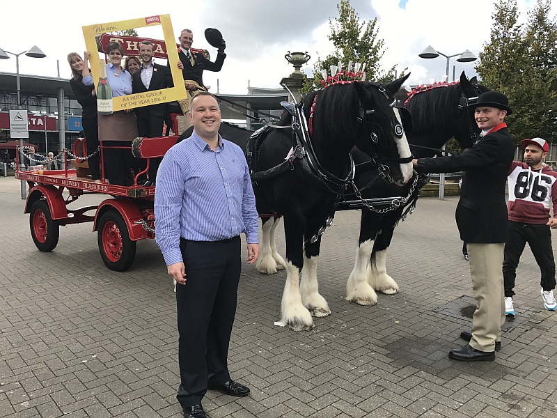 Gareth Ireland, general manager at the Aztec Hotel & Spa, with other hotel staff and the Thwaites shire horses at Bradley Stoke's Willow Brook shopping centre.