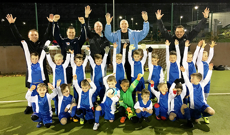 Bradley Stoke Youth FC's U6 team players and coaches celebrate receiving a brand new free kit courtesy of local McDonald’s franchisee Mike Guerin.