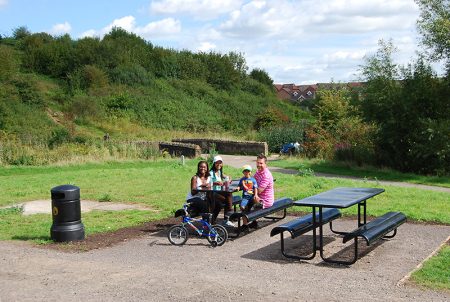 Picnic tables near the 'duck pond' in the Three Brooks Local Nature Reserve, Bradley Stoke.