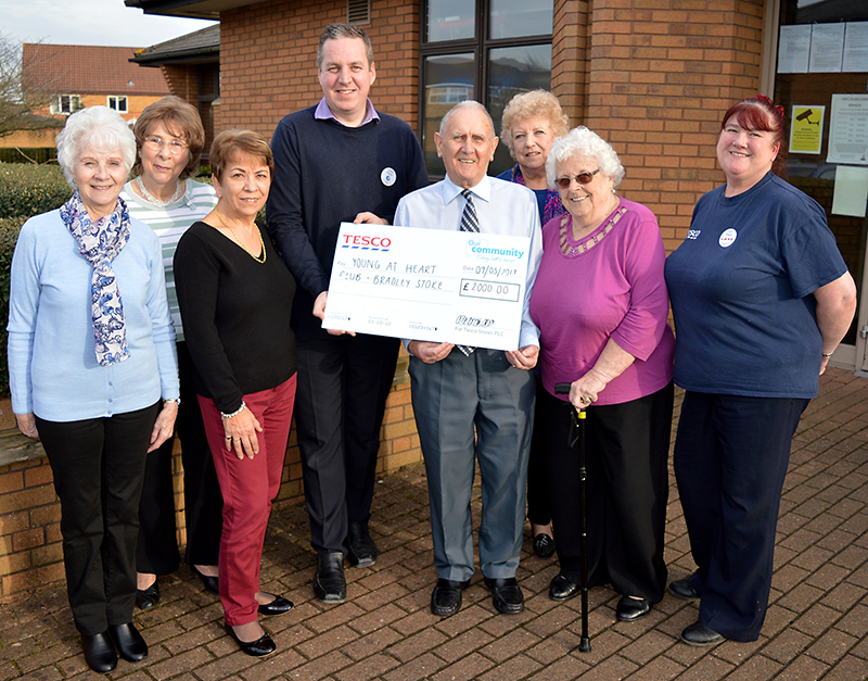 Photo of cheque presentation to members of the group.