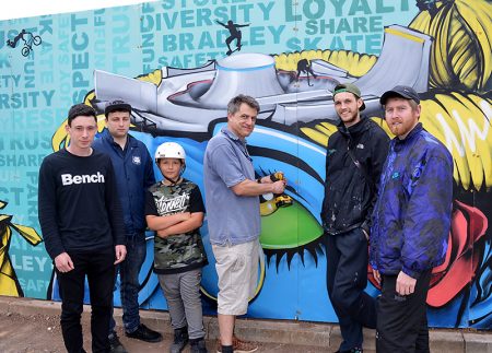 Photo of a community art panel being installed at Bradley Stoke Skate Park.