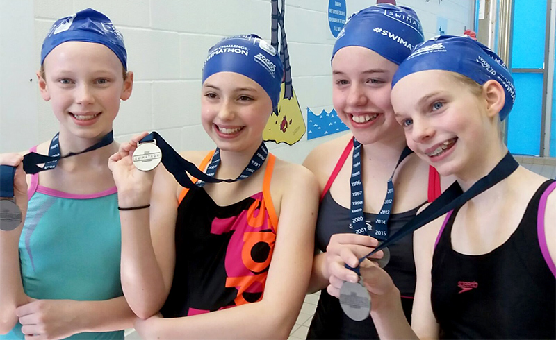 Photo of the four girls with their medals.