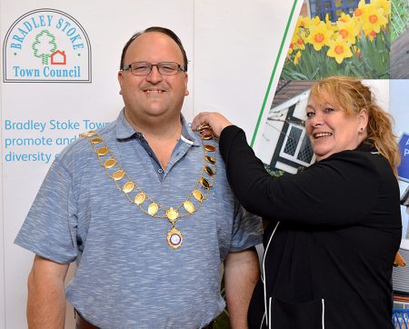 Newly elected Mayor of Bradley Stoke Cllr Andy Ward receives the chain of office from previous mayor Cllr Elaine Hardwick.