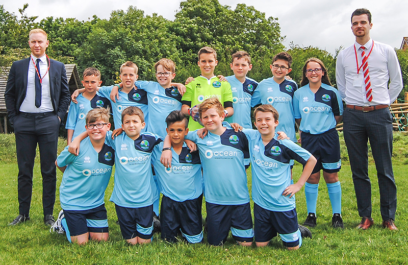 Meadowbrook Primary School's football team, sponsored by Ocean.