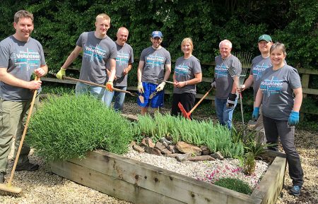 Photo of Mercer employees helping to maintain the grounds at the West of England MS Therapy Centre.