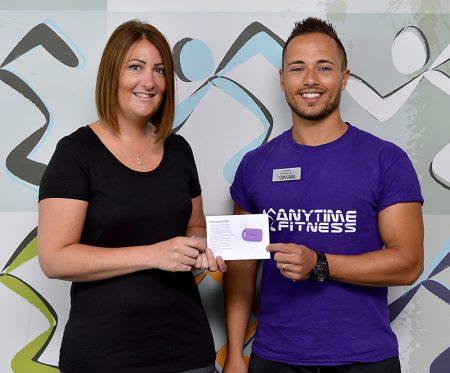 Photo of Emma Tibbott receives her membership key from Lewis Erskine.