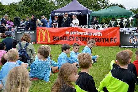 Photo of children waiting to receive awards.