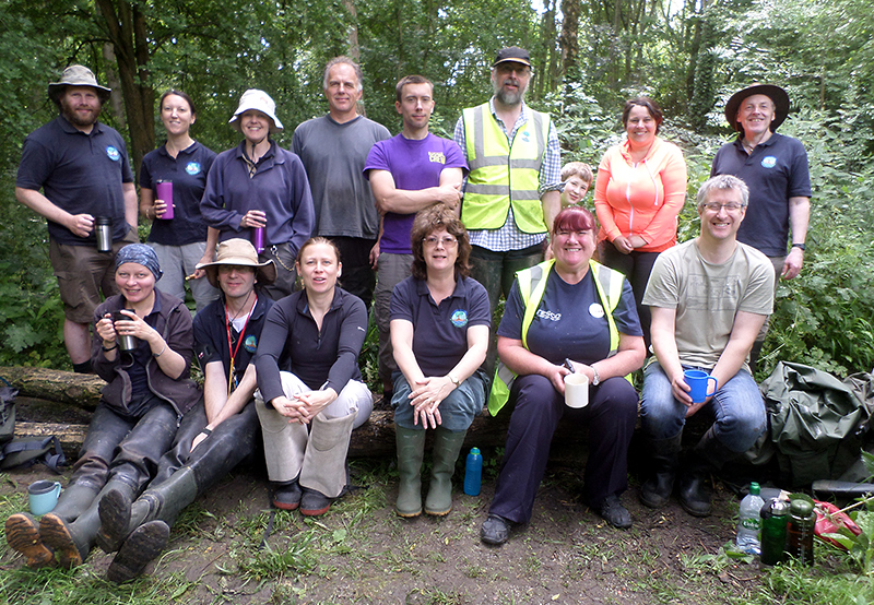 Photo of volunteers from the Three Brooks Nature Conservation Group taking a tea break.