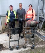 Photo of Tesco community champion Dawn Richards (left) and other volunteers from the Three Brooks Nature Conservation Group with two Tesco shopping trolleys recovered from brooks in the nature reserve.