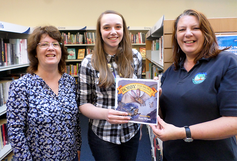 Photo of Conservation group members presenting a copy of ‘Bobby the Brown Long-Eared Bat’’ to the library.