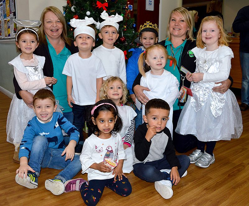 Photo of Noleen Clarke (3rd from left) and Natalie Robbins and some of the children.