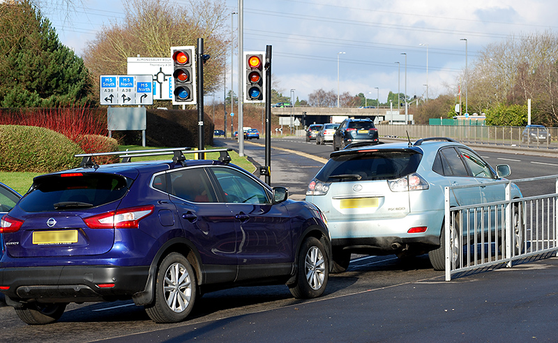 Photo of traffic signals at a pedestrian crossing over the exit slip road from the Aztec West Business Park.