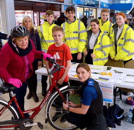 Photo of local resident Nicky Tregenza having her bike security marked by PCSO Alicia Harvey.