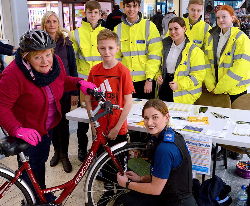 Photo of local resident Nicky Tregenza having her bike security marked by PCSO Alicia Harvey.