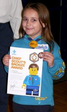 Photo of Calleigh Pace with her Chief Scout's Bronze Award certificate.