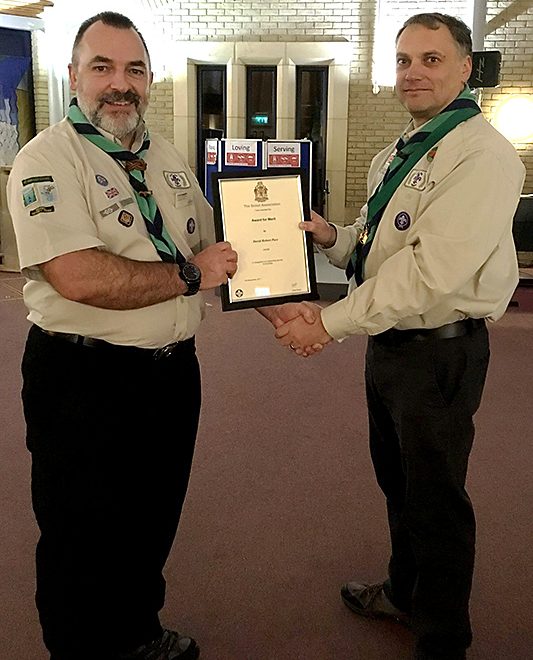 Photo of Dave Pace (right) receiving his award from Clive Mason.