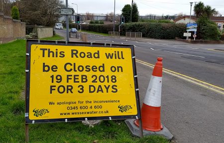 Photo of a road sign informing of a road closure on Woodlands Lane.