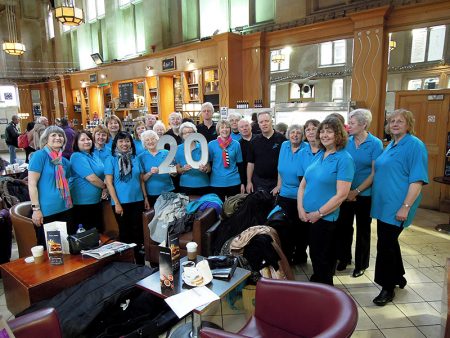 Photo of Stokes Singers in the café at Bristol Temple Meads Station.