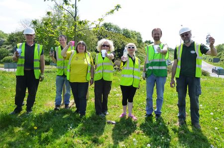 Photo of volunteers from BSiB enjoying a break while working on Great Stoke Roundabout.