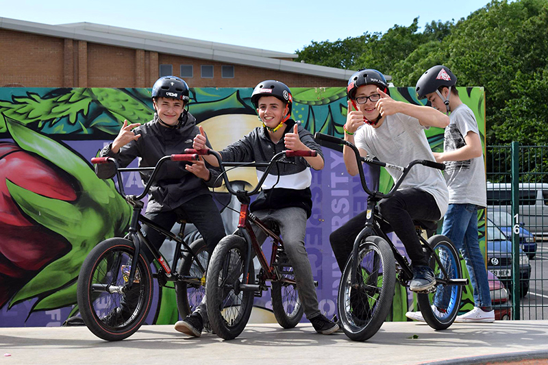 Photo of three young BMX riders at the 2017 skate park competition.